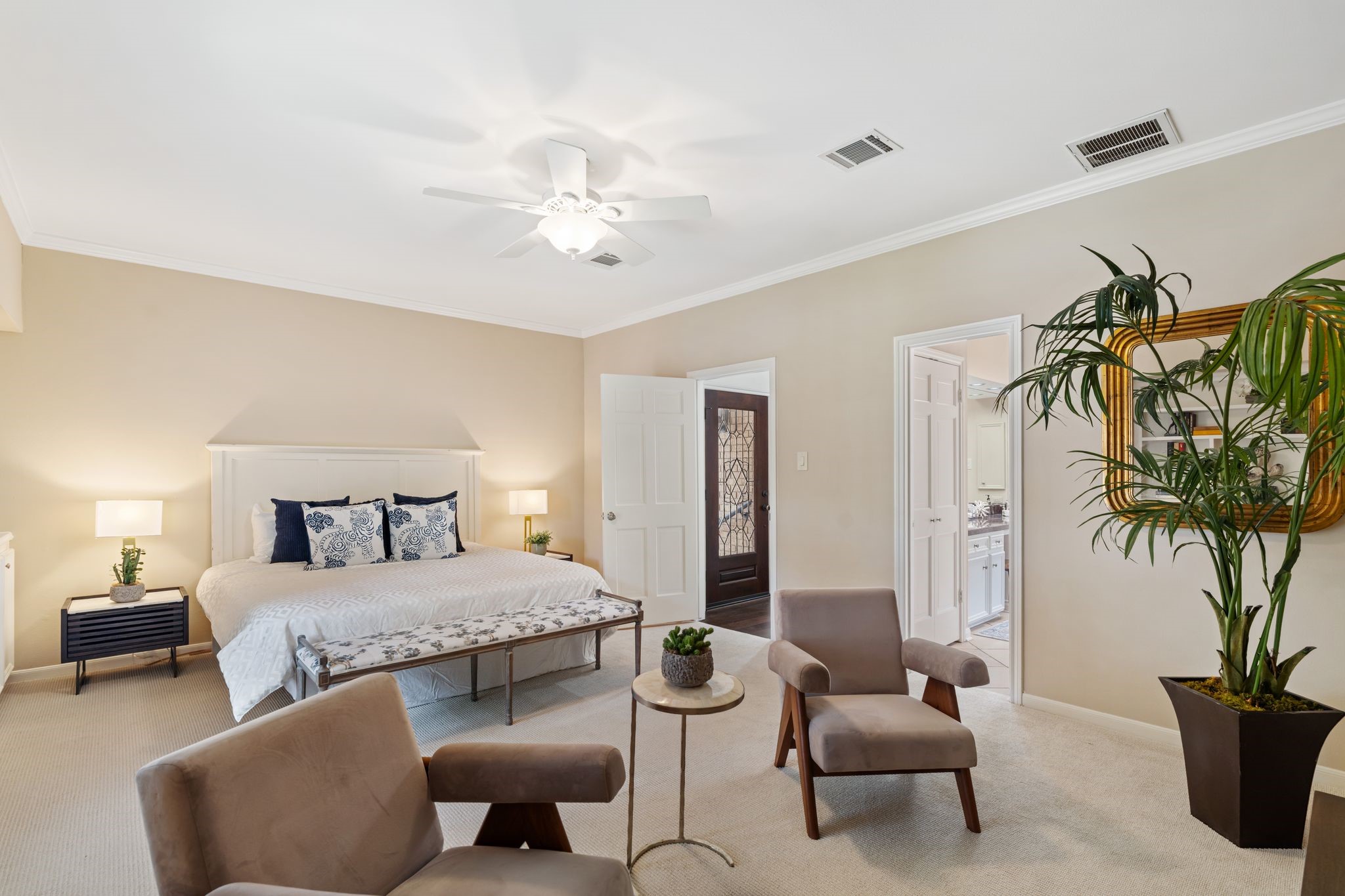 7416 Kelving Street Houston, TX 77030 - Photo 3 of 35 a bedroom with furniture and a potted plant