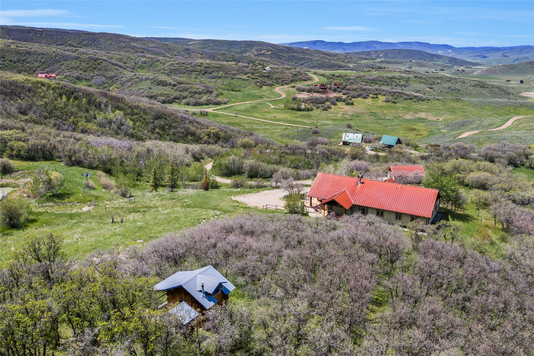 31485 Deerwood Ranch Road Steamboat Springs, CO 80487 - Photo 49 of 49 an aerial view of a house with a yard