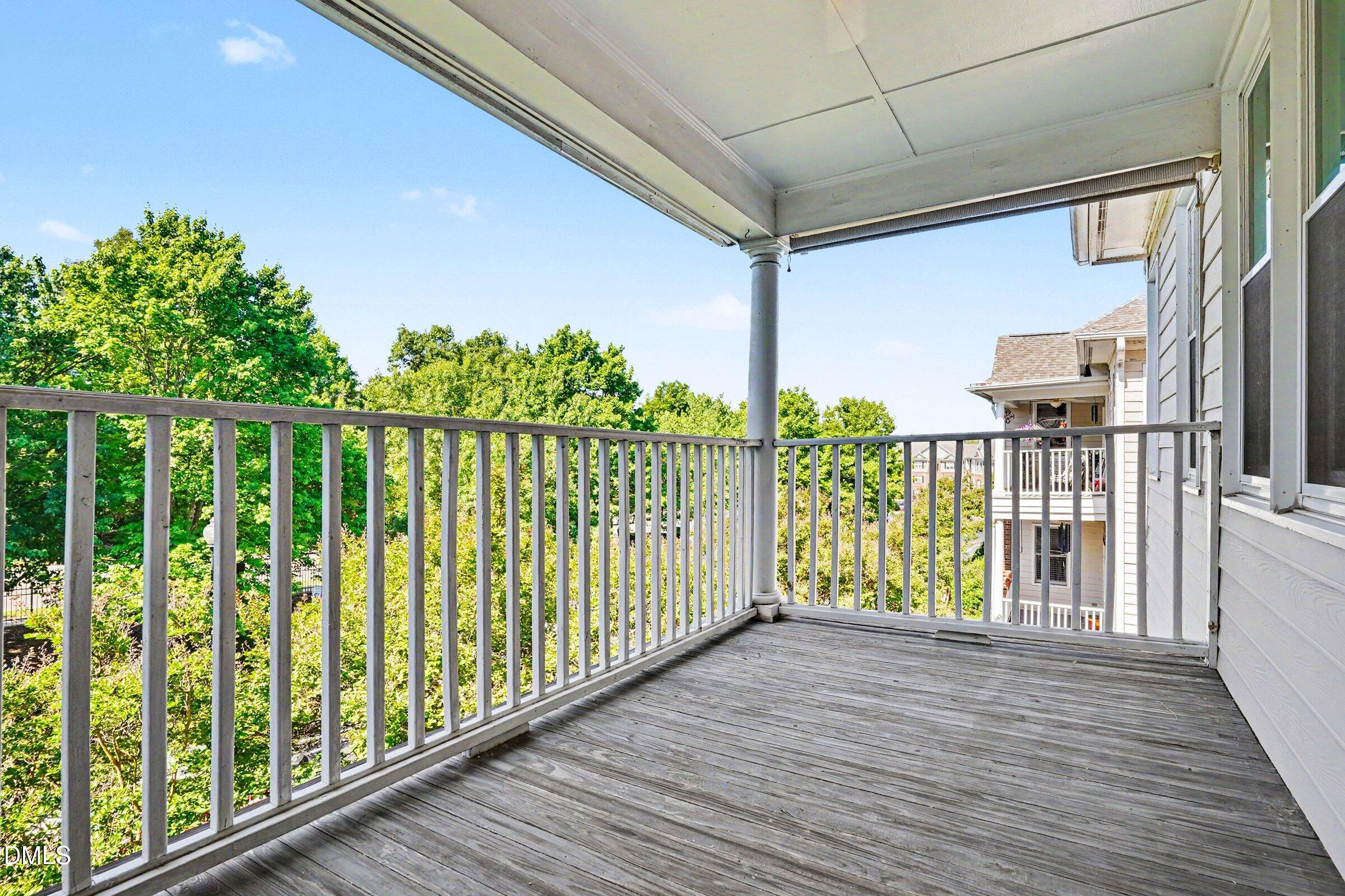 2651 Mellowfield Drive, Unit 203 Raleigh, NC 27604 - Photo 23 of 32 a view of a balcony with wooden floor