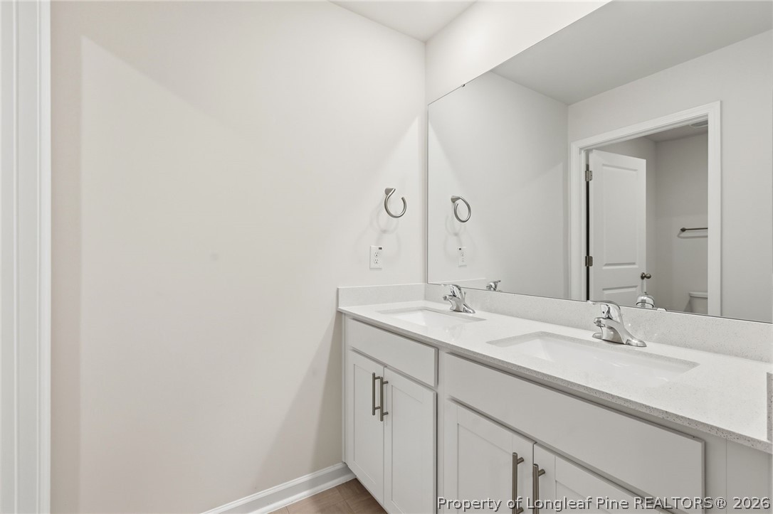 2208 Clydesmill Road Fayetteville, NC 28314 - Photo 8 of 26 a bathroom with a sink and a mirror