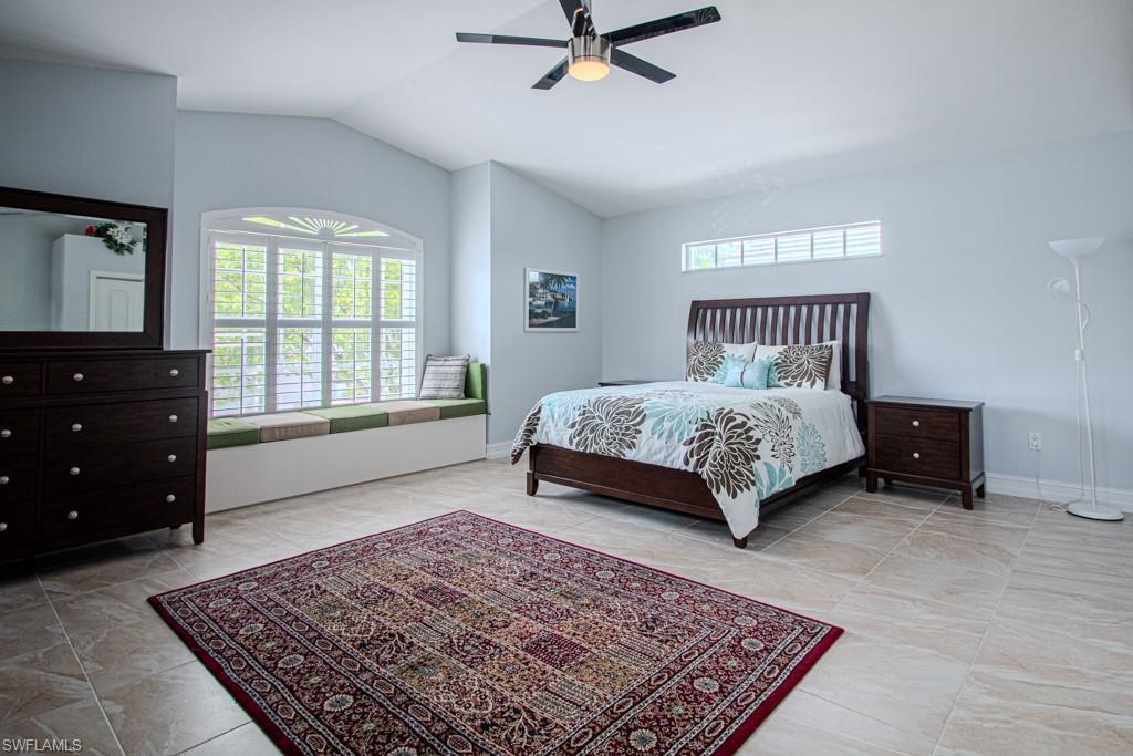 6015 Pinnacle Lane, Unit 5 Naples, FL 34110 - Photo 16 of 25 a bedroom with a bed and a window
