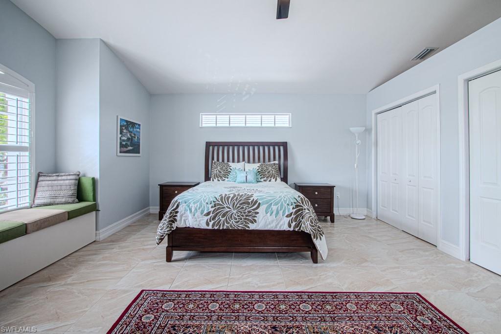 6015 Pinnacle Lane, Unit 5 Naples, FL 34110 - Photo 17 of 25 a bedroom with a bed and a window