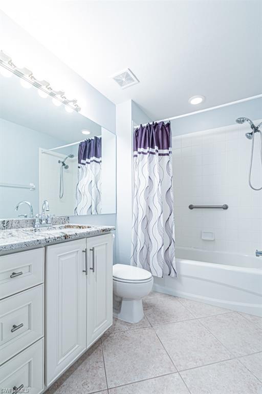 6015 Pinnacle Lane, Unit 5 Naples, FL 34110 - Photo 20 of 25 a bathroom with a granite countertop sink toilet and shower