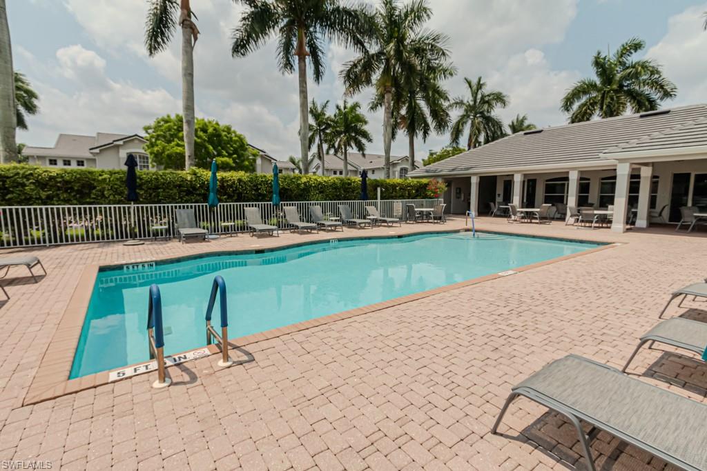 6015 Pinnacle Lane, Unit 5 Naples, FL 34110 - Photo 22 of 25 a view of a house with swimming pool and sitting area