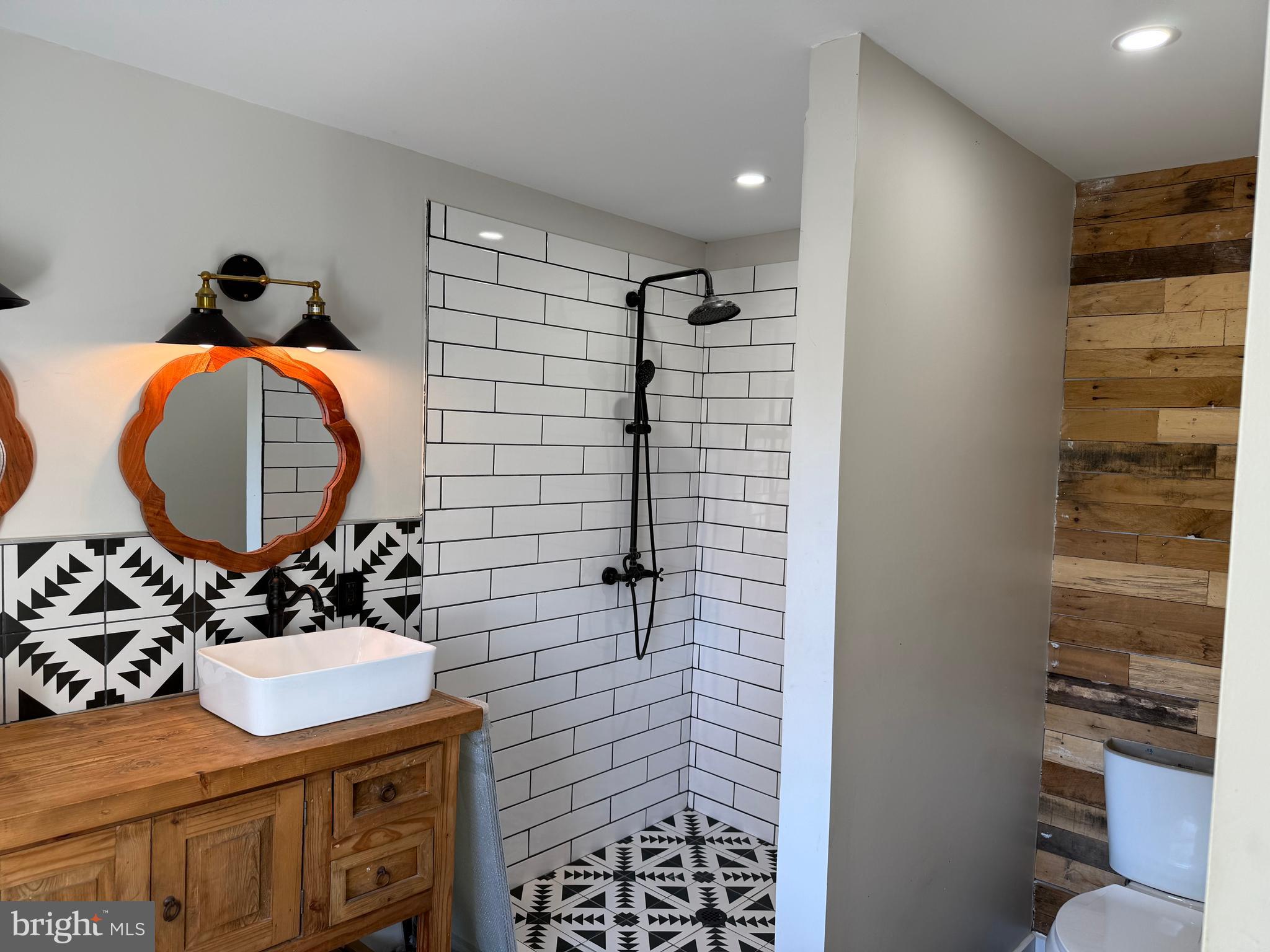 204 Compromise Road Mannington, NJ 08098 - Photo 17 of 25 a bathroom with a sink a toilet and shower