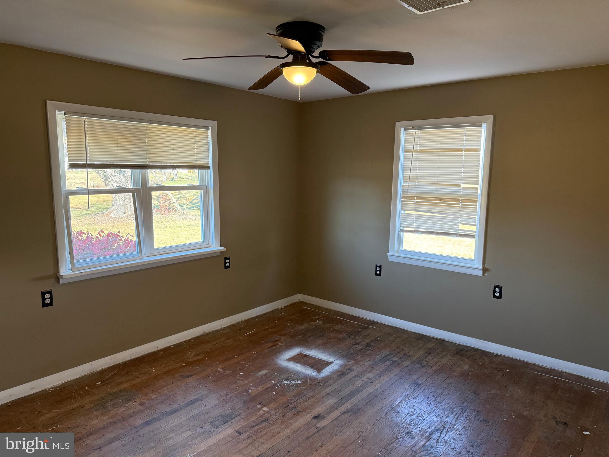 204 Compromise Road Mannington, NJ 08098 - Photo 20 of 25 a room with window and wooden floor