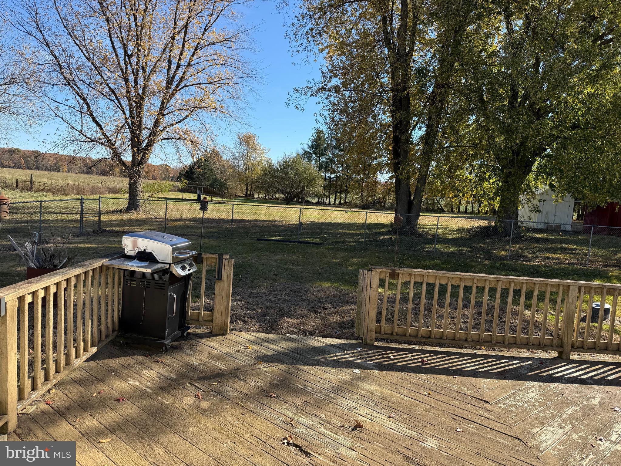 204 Compromise Road Mannington, NJ 08098 - Photo 23 of 25 a view of a street with a bench next to a yard