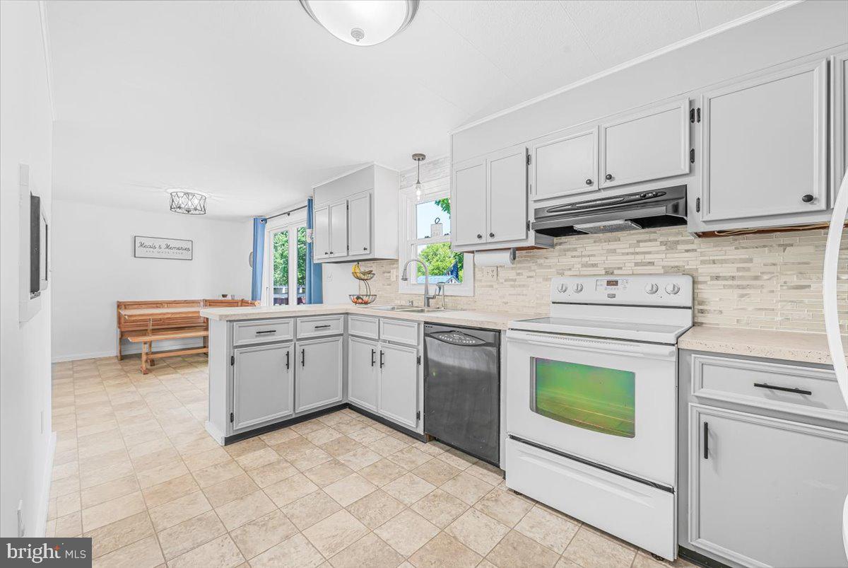 14011 Pryor Road Thurmont, MD 21788 - Photo 13 of 38 a kitchen with cabinets appliances and a window