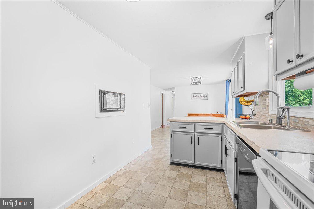 14011 Pryor Road Thurmont, MD 21788 - Photo 15 of 38 a kitchen with a sink cabinets and counter space