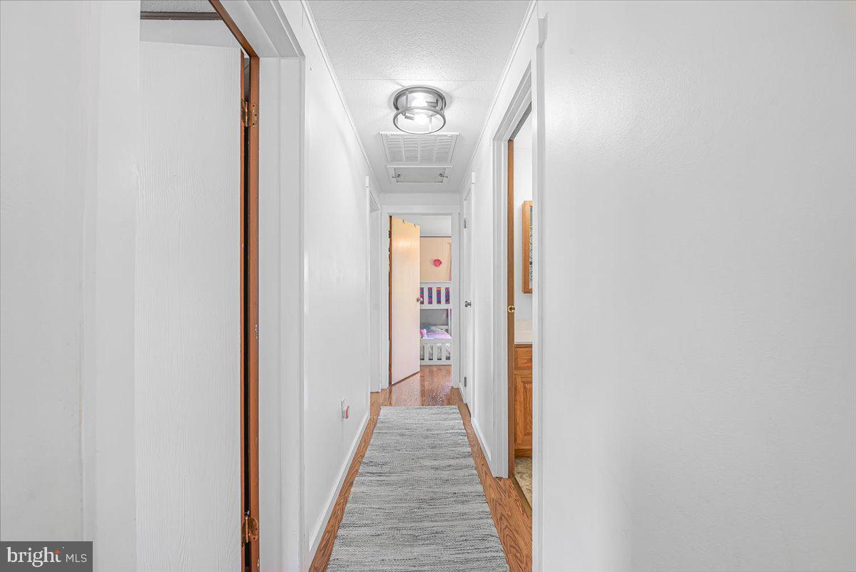 14011 Pryor Road Thurmont, MD 21788 - Photo 16 of 38 a view of a hallway with wooden floor
