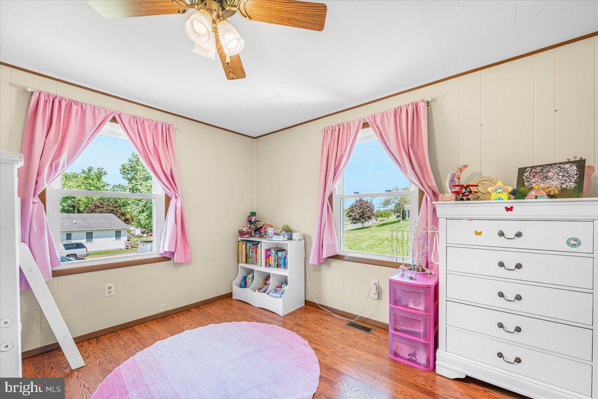 14011 Pryor Road Thurmont, MD 21788 - Photo 20 of 38 a bedroom with a bed and a dresser next to a window