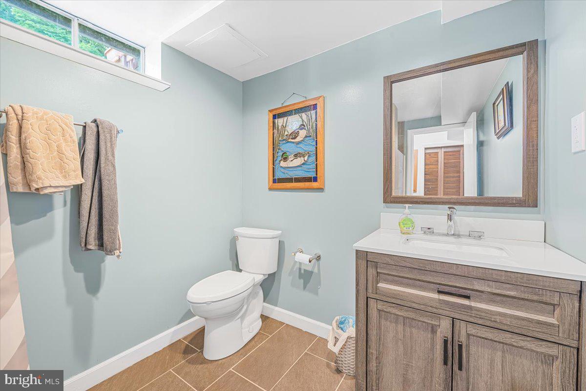 14011 Pryor Road Thurmont, MD 21788 - Photo 31 of 38 a bathroom with a sink a toilet and a mirror