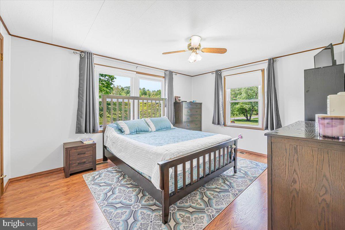 14011 Pryor Road Thurmont, MD 21788 - Photo 7 of 38 a bedroom with a bed and a large window with outer view