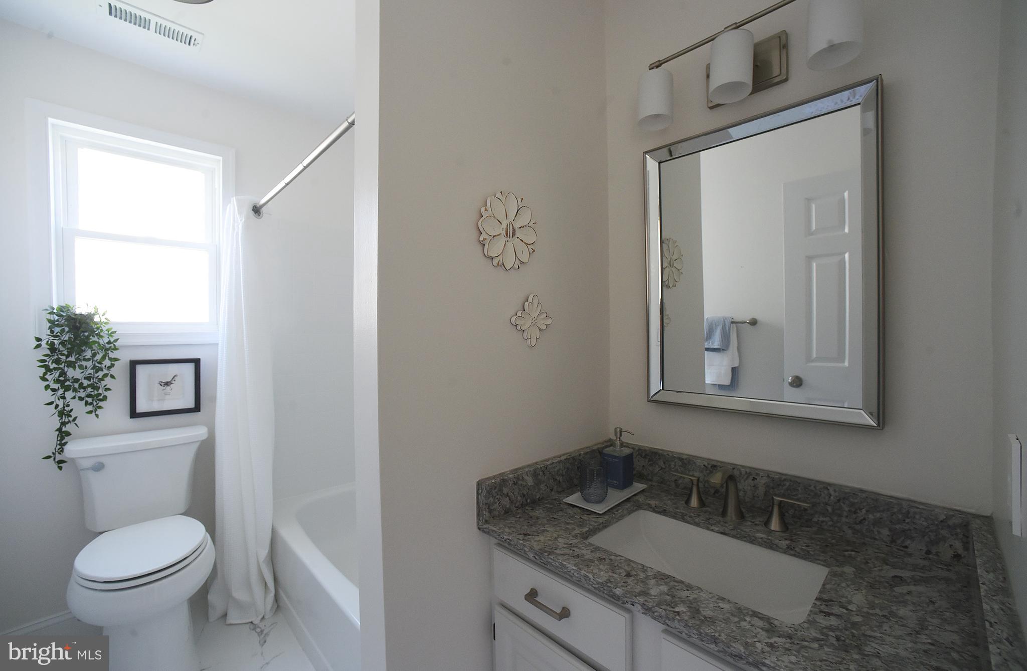 4 Deep Hollow Lane North Columbus, NJ 08022 - Photo 17 of 27 a bathroom with a granite countertop sink toilet and mirror