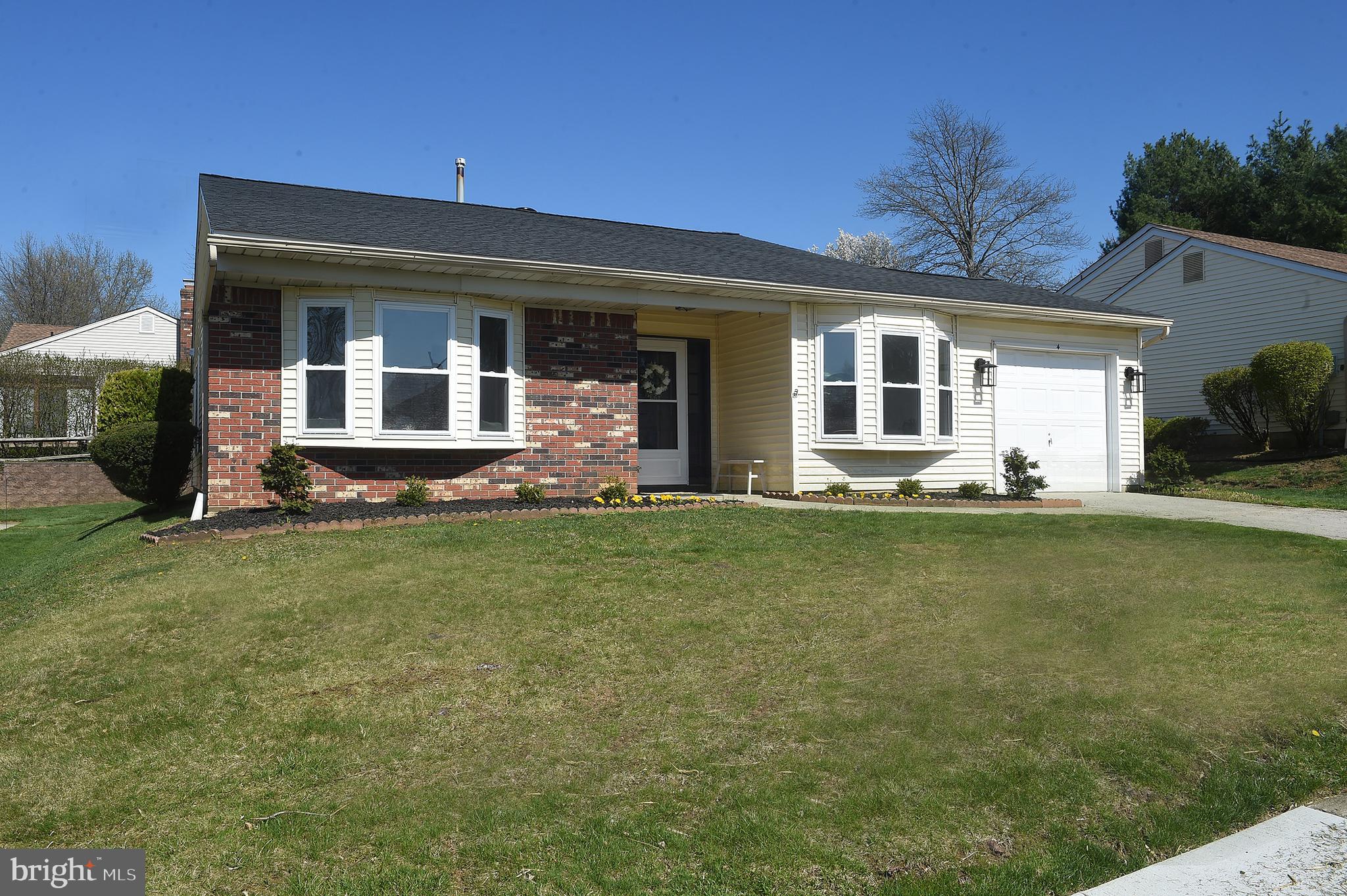 4 Deep Hollow Lane North Columbus, NJ 08022 - Photo 2 of 27 a front view of a house with a yard