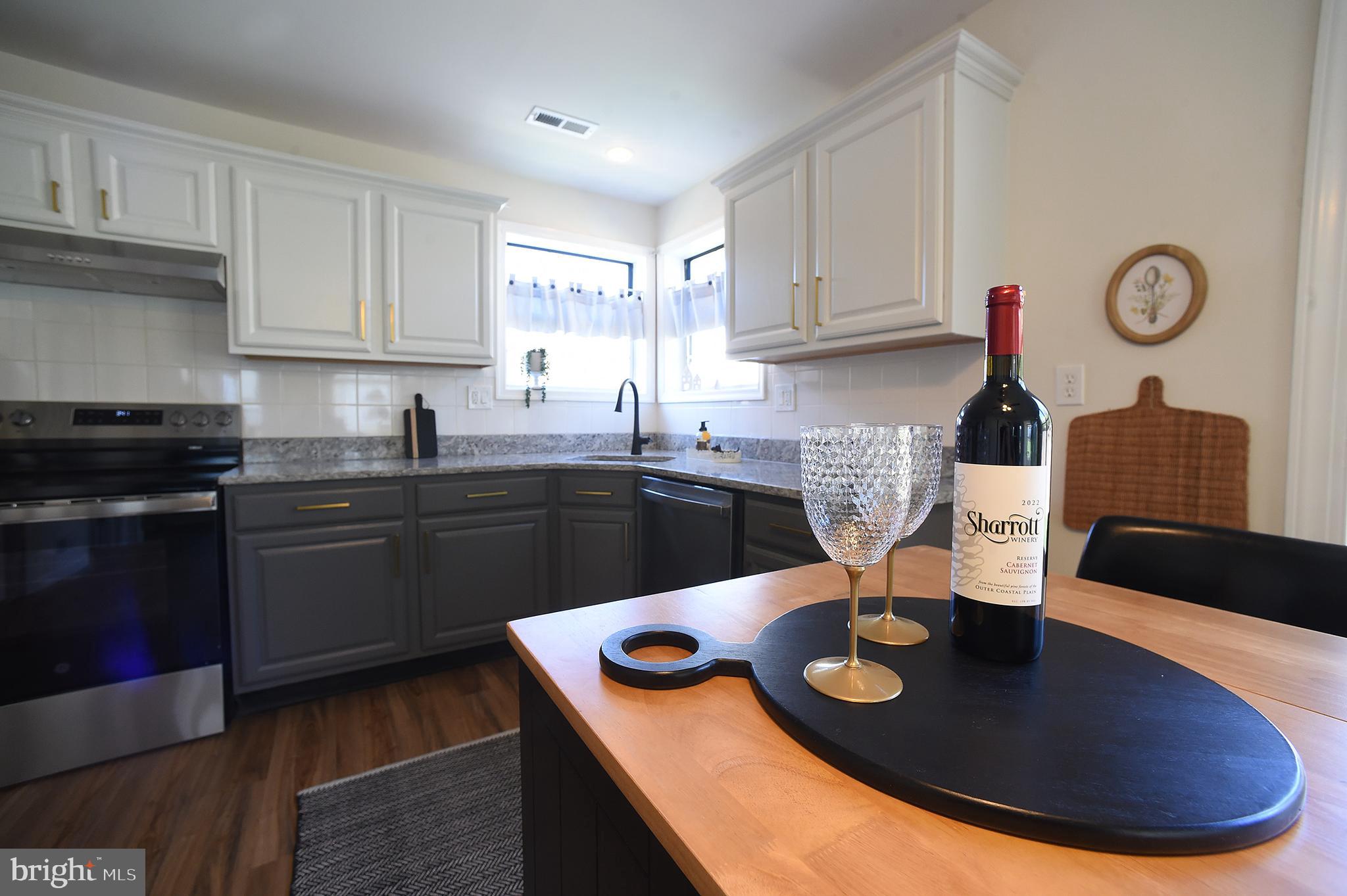 4 Deep Hollow Lane North Columbus, NJ 08022 - Photo 9 of 27 a kitchen with granite countertop a sink and cabinets