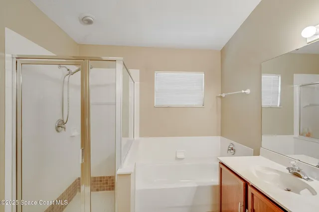 a bathroom with a bathtub and a sink