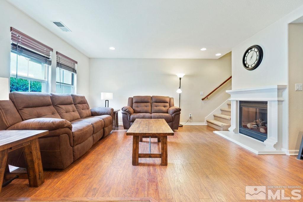 7686 Pebblestone Way Reno, NV 89523 - Photo 12 of 35 a living room with furniture and a fireplace