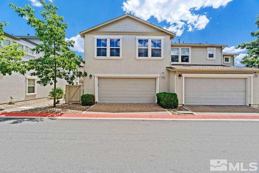 7686 Pebblestone Way Reno, NV 89523 - Photo 2 of 35 a front view of a house with a yard and garage