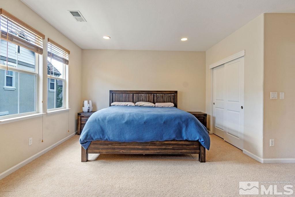7686 Pebblestone Way Reno, NV 89523 - Photo 25 of 35 a bedroom with a bed and window