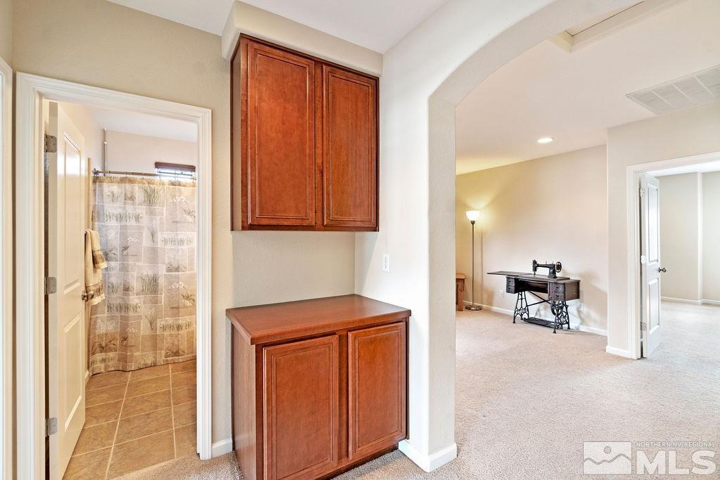 7686 Pebblestone Way Reno, NV 89523 - Photo 30 of 35 a view of living room with furniture and a flat screen tv
