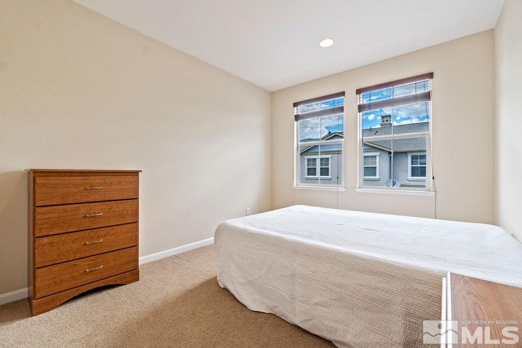 7686 Pebblestone Way Reno, NV 89523 - Photo 32 of 35 a bedroom with a bed and a dresser