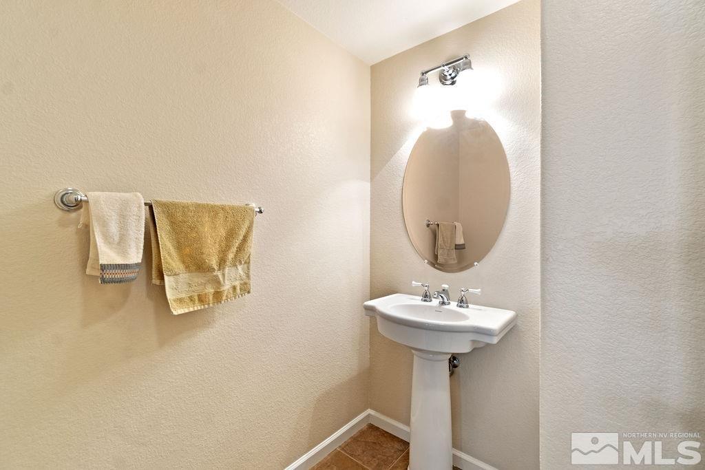 7686 Pebblestone Way Reno, NV 89523 - Photo 34 of 35 a bathroom with a sink and a mirror