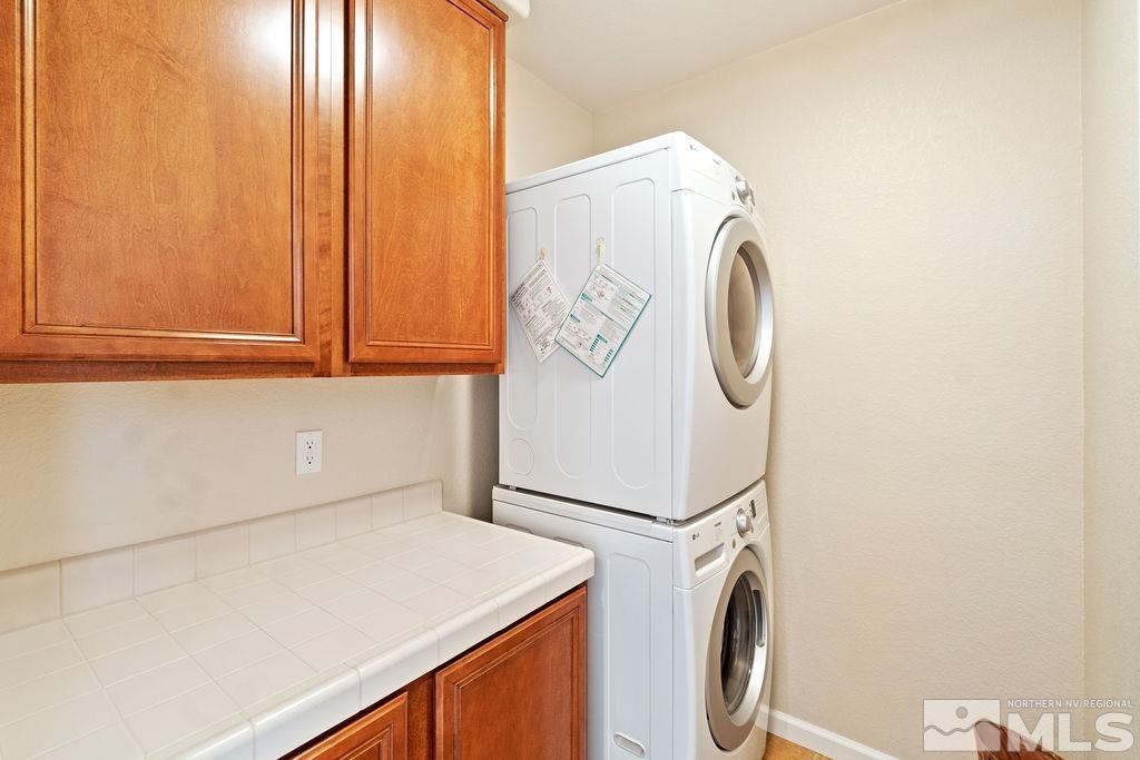 7686 Pebblestone Way Reno, NV 89523 - Photo 35 of 35 a utility room with dryer and washer