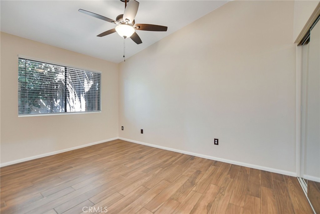 9505 Arlington Avenue, Unit 89 Riverside, CA 92503 - Photo 19 of 26 wooden floor in an empty room with a window