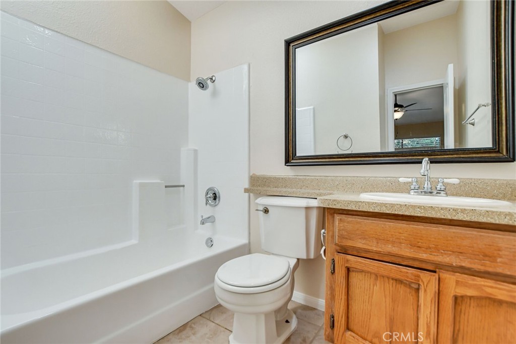 9505 Arlington Avenue, Unit 89 Riverside, CA 92503 - Photo 20 of 26 a bathroom with a sink a toilet and a bathtub