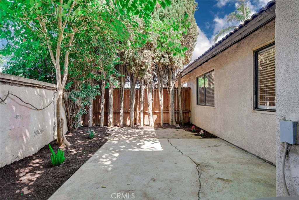 9505 Arlington Avenue, Unit 89 Riverside, CA 92503 - Photo 24 of 26 a view of a house with a backyard