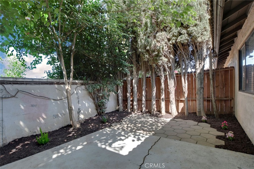 9505 Arlington Avenue, Unit 89 Riverside, CA 92503 - Photo 25 of 26 a view of a backyard with tree