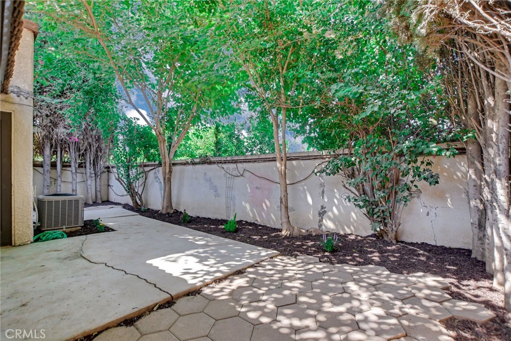 9505 Arlington Avenue, Unit 89 Riverside, CA 92503 - Photo 26 of 26 a backyard of a house with lots of trees