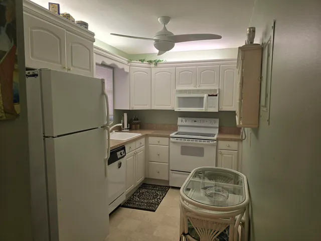 a kitchen with stainless steel appliances a refrigerator stove and sink