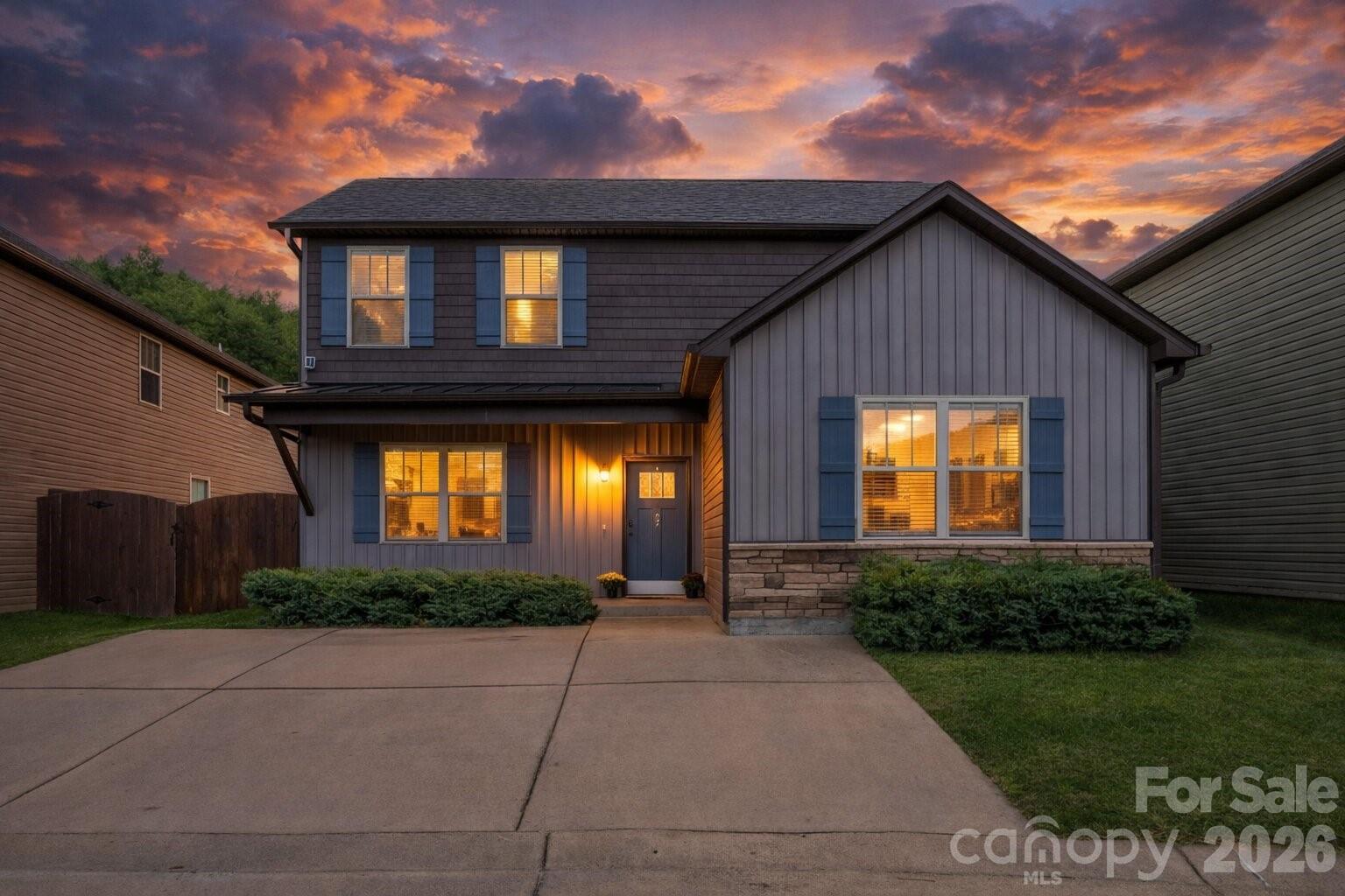 27 Mann Lane Fletcher, NC 28732 - Photo 1 of 25 a front view of a house with garden