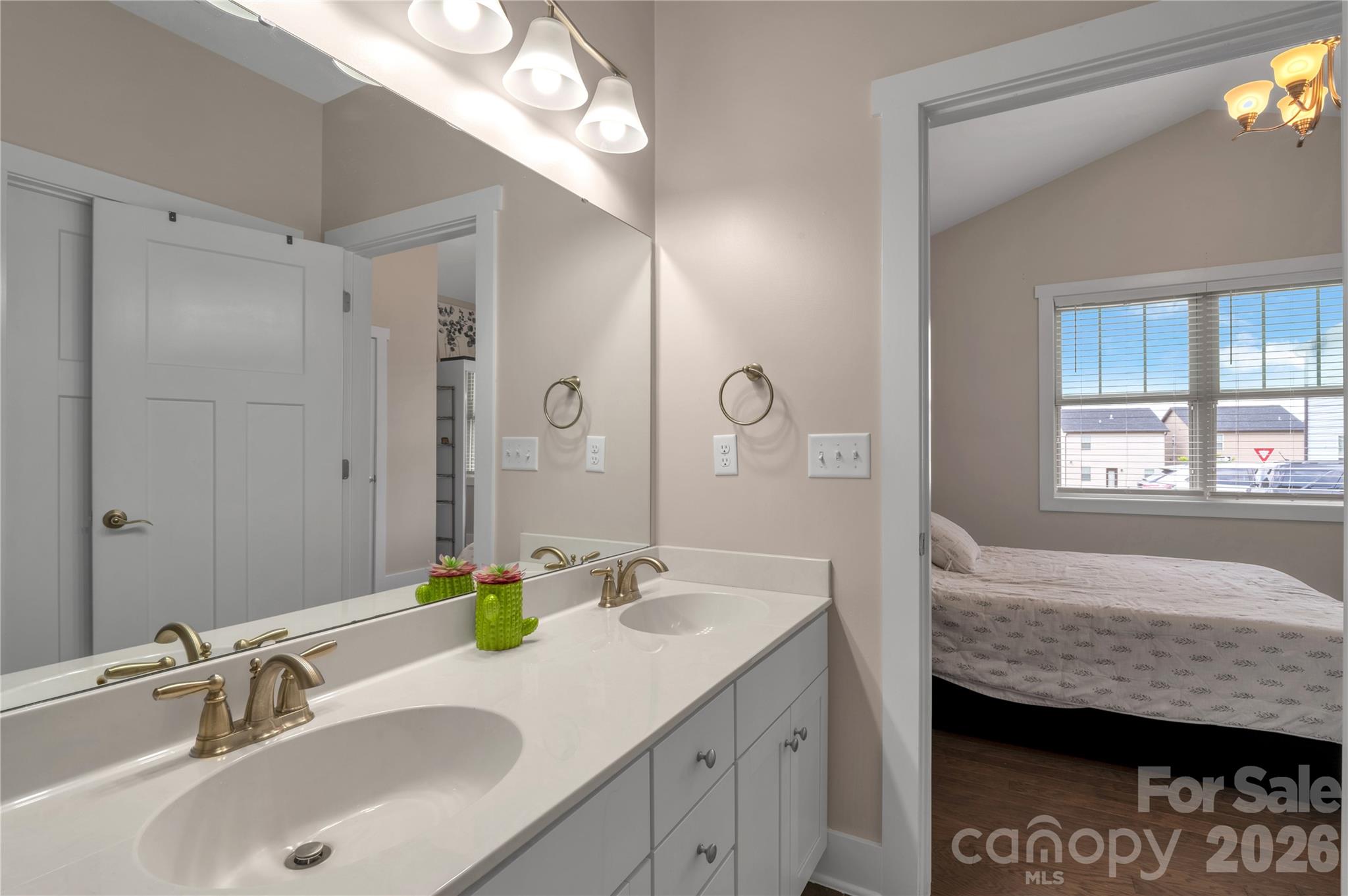 27 Mann Lane Fletcher, NC 28732 - Photo 13 of 25 a bathroom with a granite countertop sink a mirror and a shower