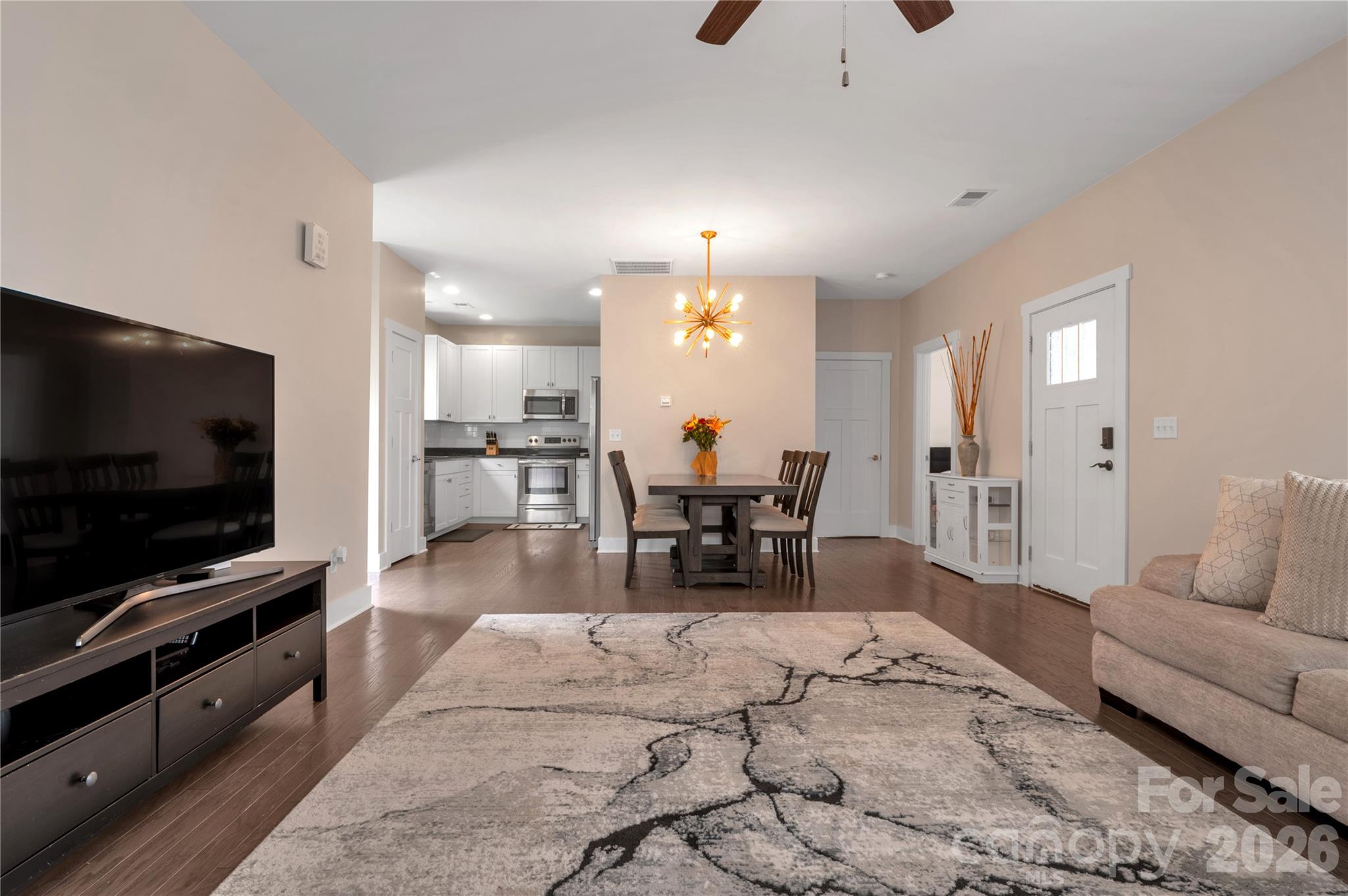 27 Mann Lane Fletcher, NC 28732 - Photo 3 of 25 a living room with furniture and a flat screen tv