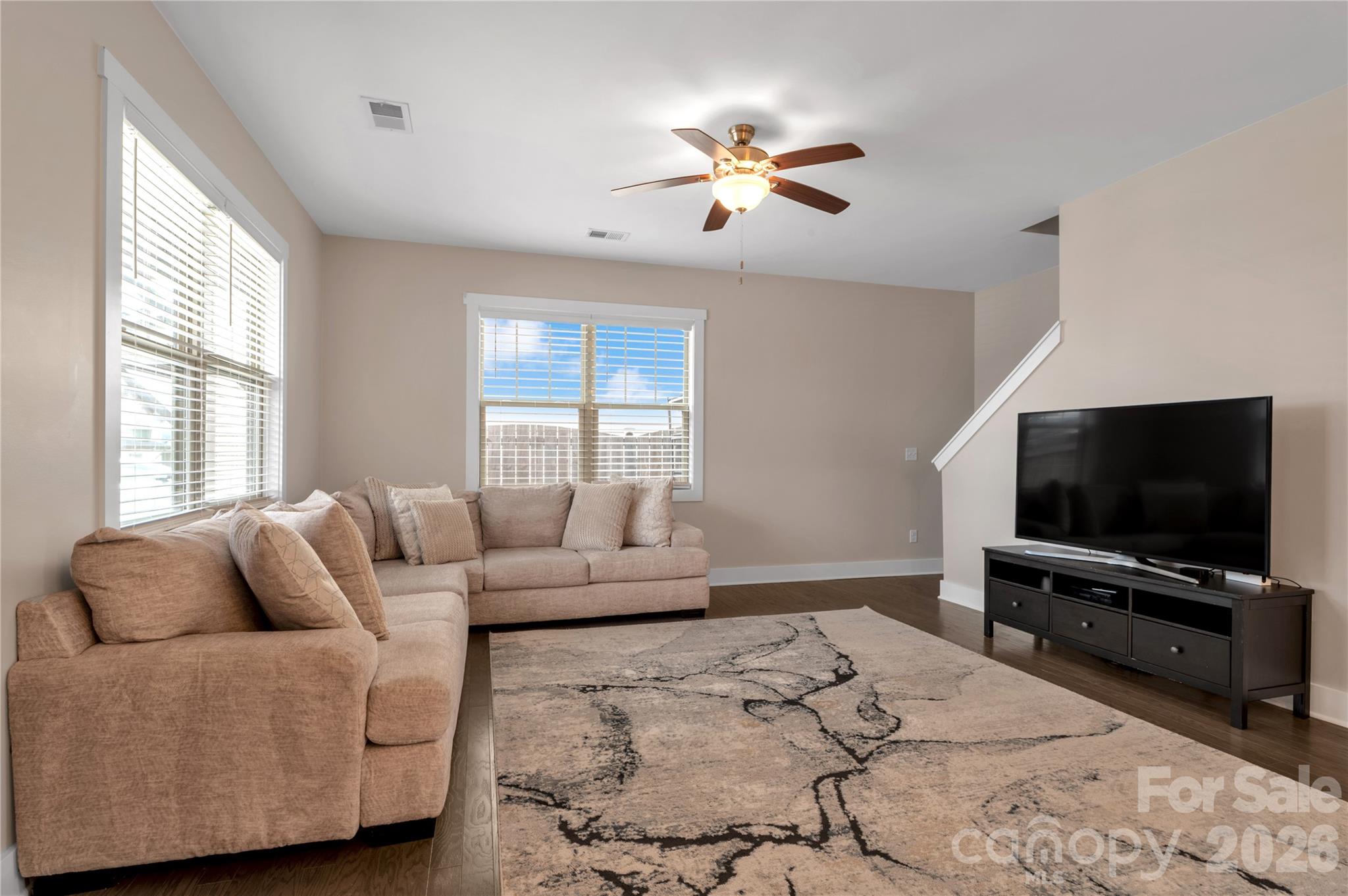 27 Mann Lane Fletcher, NC 28732 - Photo 6 of 25 a living room with furniture and a flat screen tv