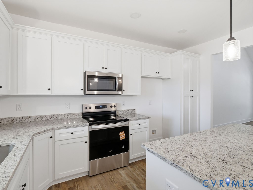 3706 Broad St Road Gum Spring, VA 23065 - Photo 5 of 34 a kitchen with granite countertop white cabinets and stainless steel appliances