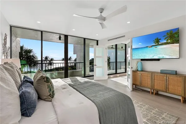 a bed room with a bed window and television