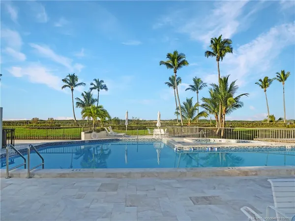 a view of a swimming pool and a lake