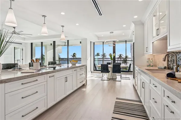 a large kitchen with lots of counter space and window
