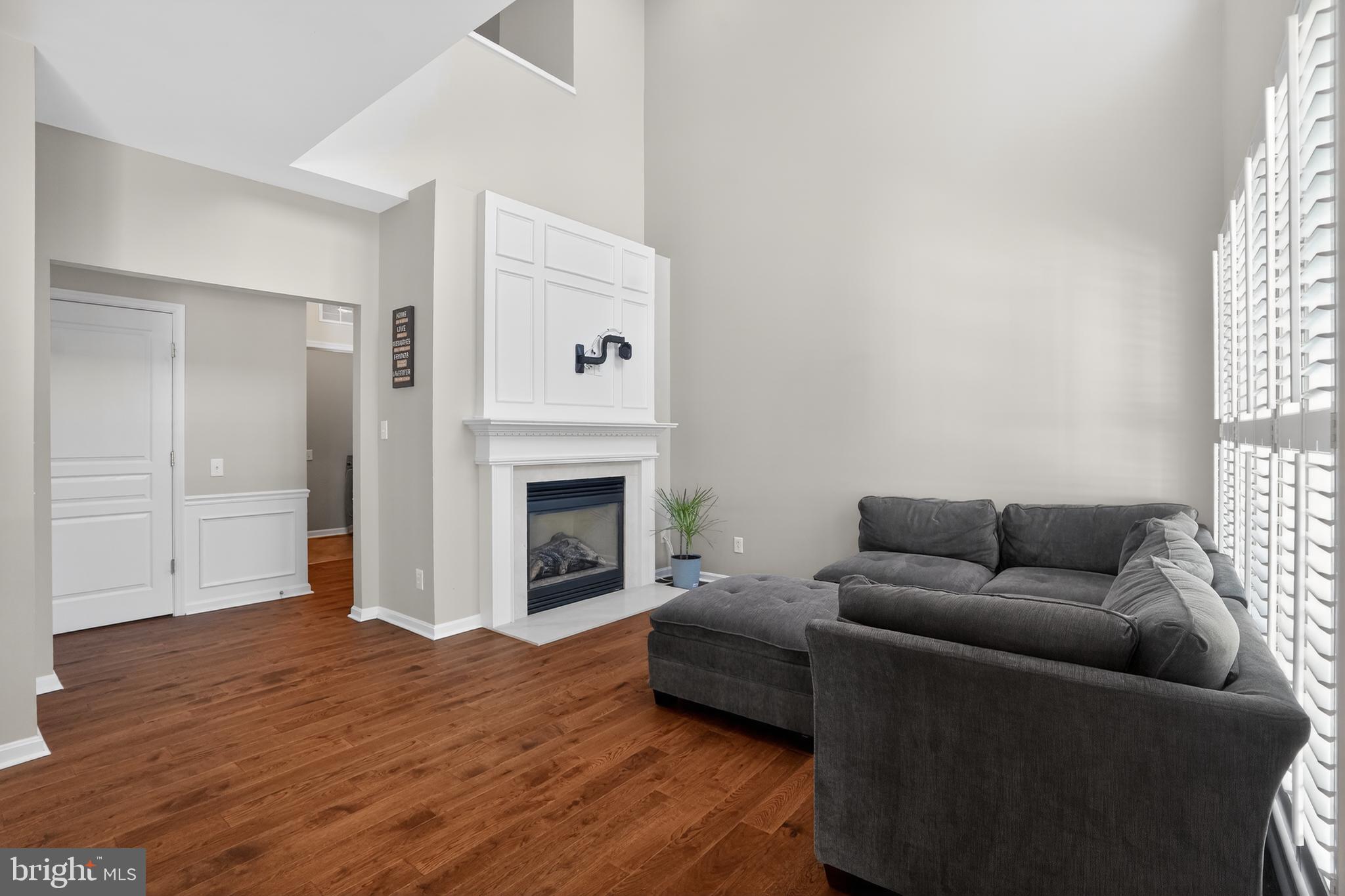 694 Churchill Road Chester Springs, PA 19425 - Photo 15 of 49 a living room with furniture and a fireplace