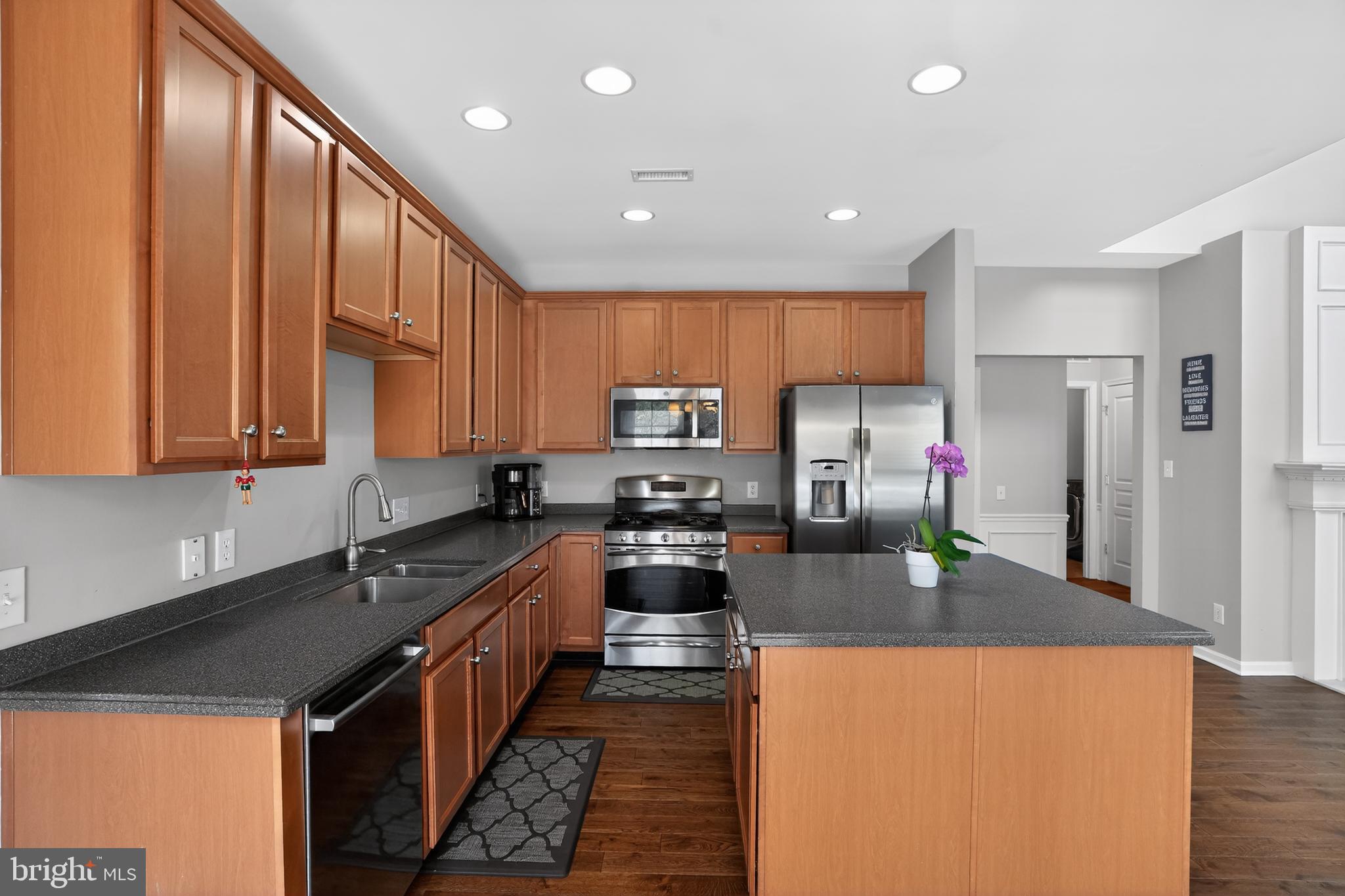 694 Churchill Road Chester Springs, PA 19425 - Photo 19 of 49 a kitchen with stainless steel appliances granite countertop a refrigerator a stove top oven a sink and dishwasher