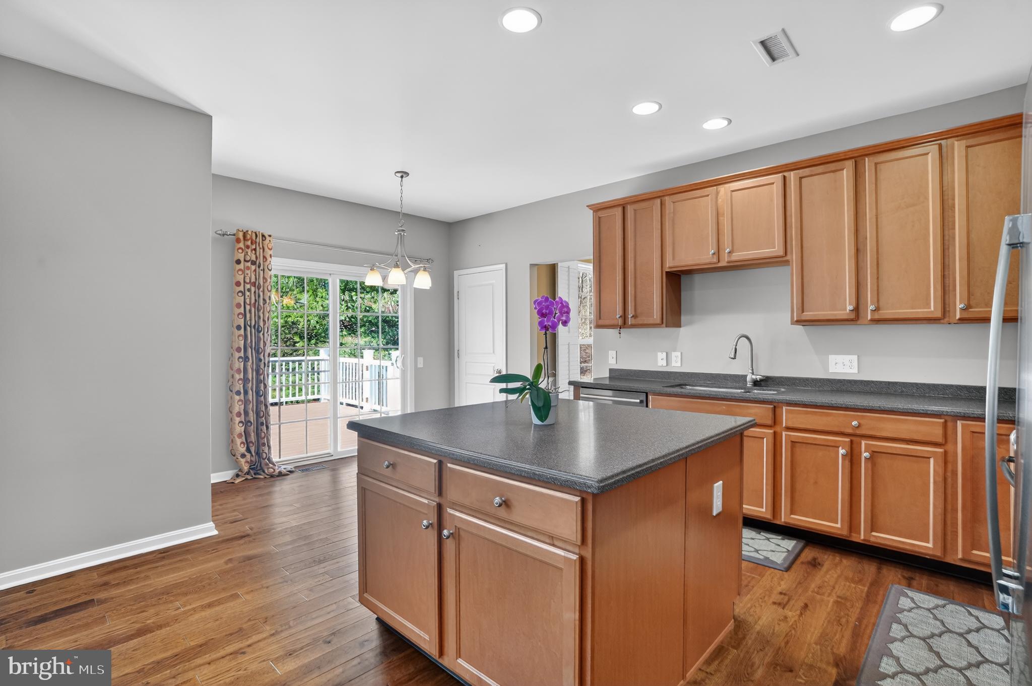 694 Churchill Road Chester Springs, PA 19425 - Photo 22 of 49 a kitchen with stainless steel appliances granite countertop a sink stove and cabinets