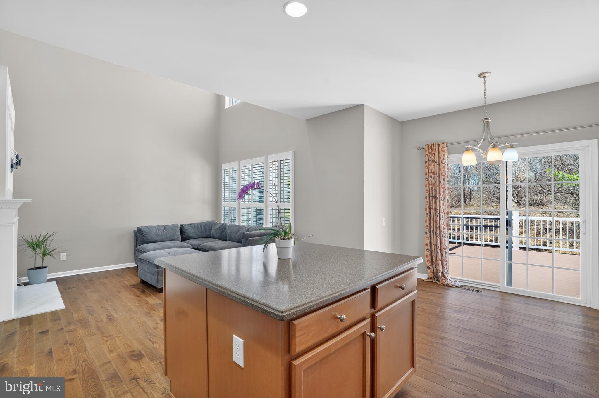 694 Churchill Road Chester Springs, PA 19425 - Photo 23 of 49 a kitchen with stainless steel appliances granite countertop a sink window and wooden floor