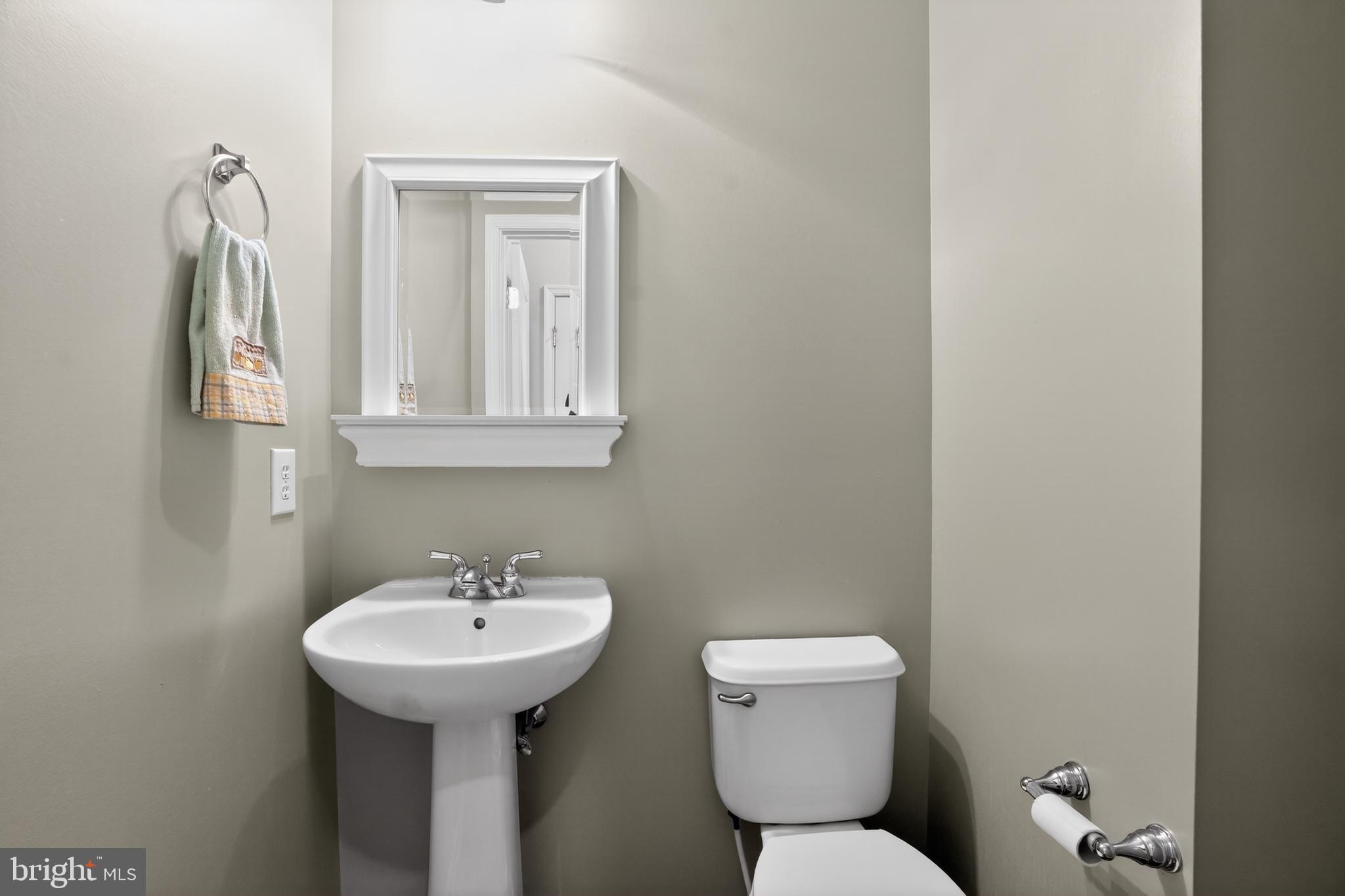 694 Churchill Road Chester Springs, PA 19425 - Photo 24 of 49 a bathroom with a toilet sink and mirror