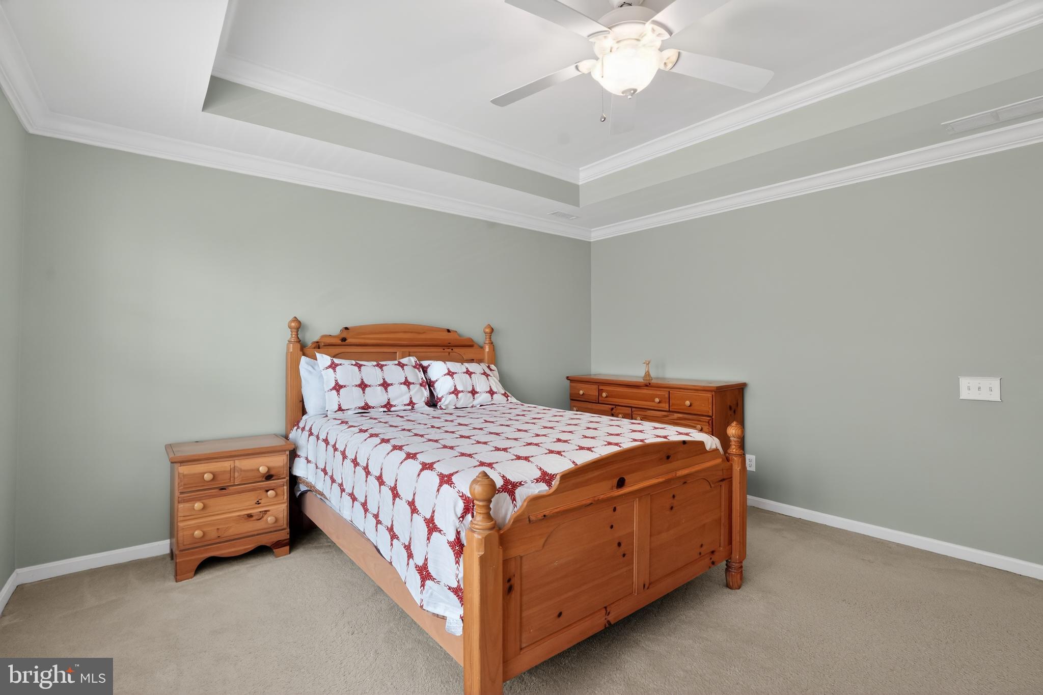 694 Churchill Road Chester Springs, PA 19425 - Photo 29 of 49 a bedroom with a bed and a chandelier