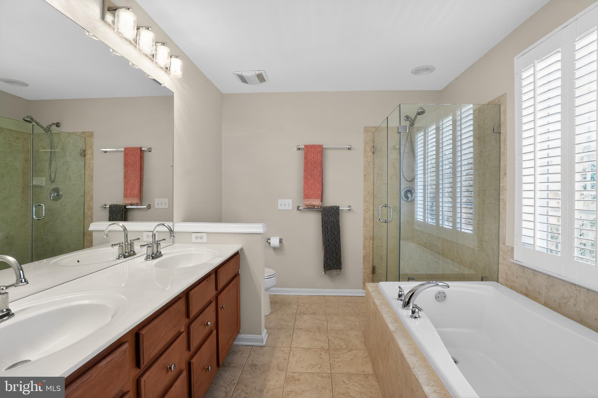 694 Churchill Road Chester Springs, PA 19425 - Photo 31 of 49 a spacious bathroom with sink shower and a bathtub