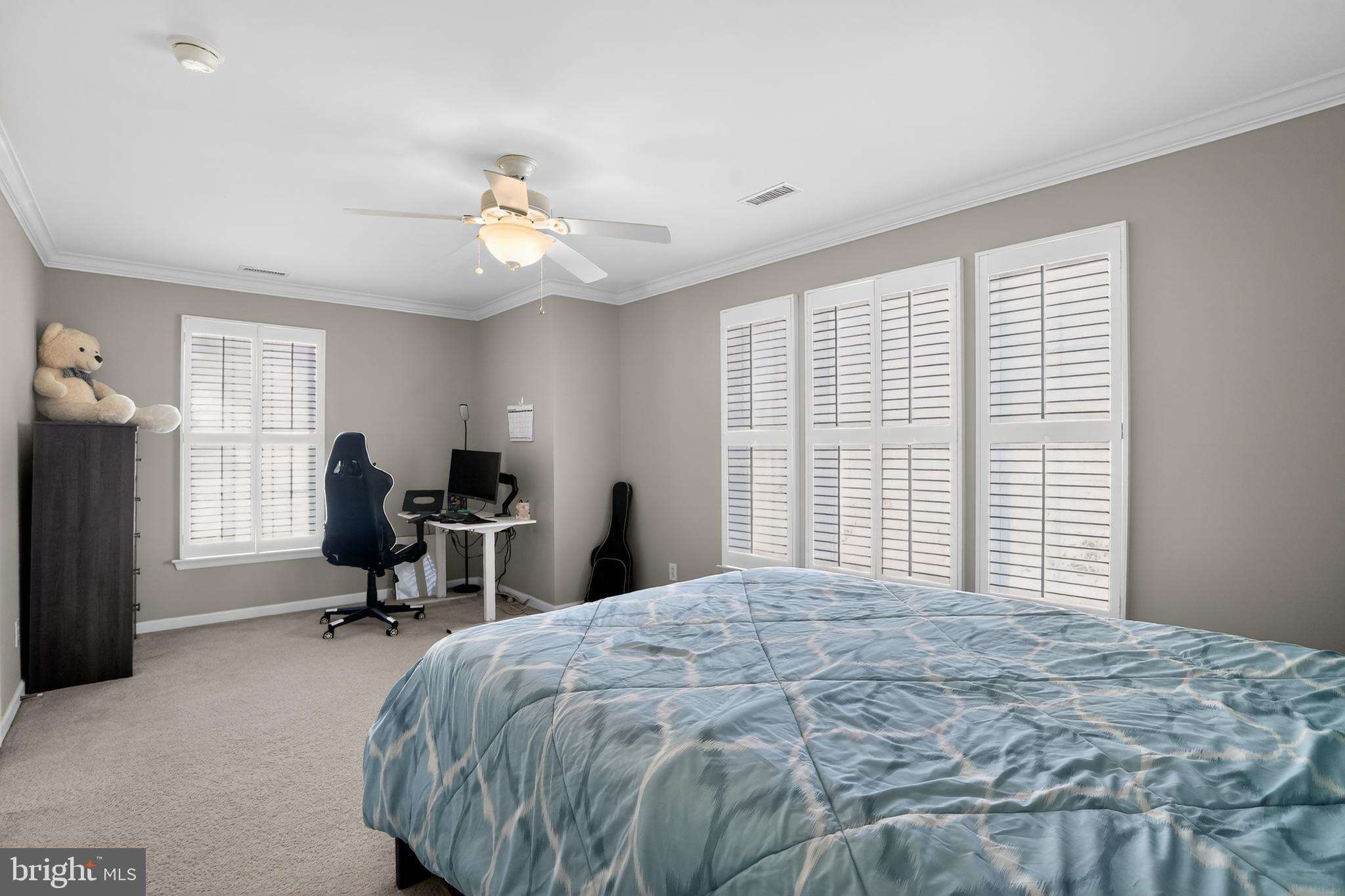 694 Churchill Road Chester Springs, PA 19425 - Photo 34 of 49 a bedroom with a bed and a large window